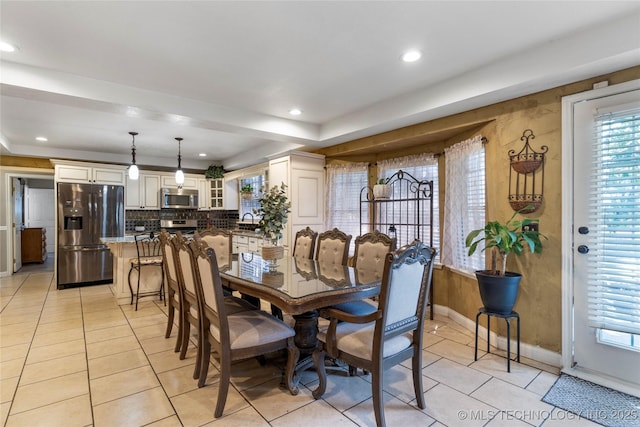 dining room featuring light tile patterned floors, baseboards, and recessed lighting