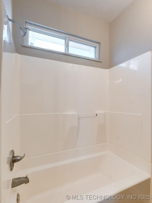 bathroom featuring tub / shower combination