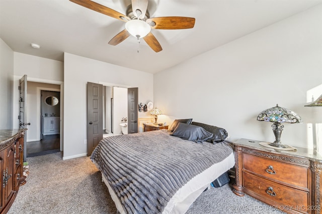 carpeted bedroom with a ceiling fan and baseboards