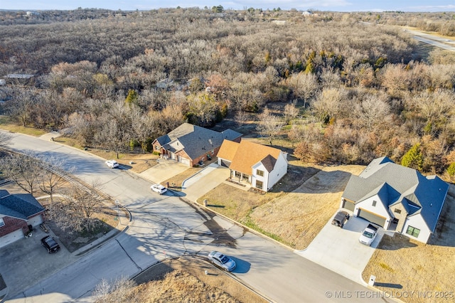 drone / aerial view with a view of trees