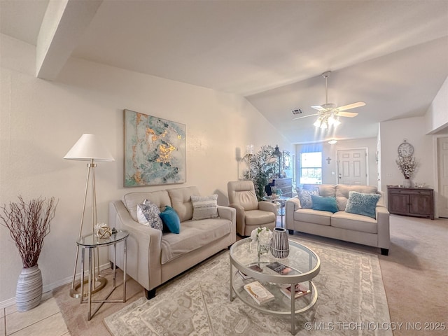 tiled living area featuring visible vents, baseboards, carpet floors, lofted ceiling, and ceiling fan