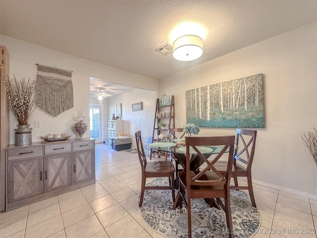 dining room with visible vents, baseboards, and light tile patterned flooring