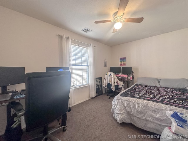 bedroom featuring visible vents, carpet floors, and ceiling fan