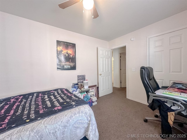 carpeted bedroom with baseboards and a ceiling fan