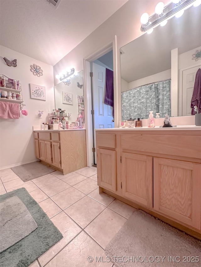 bathroom featuring a shower with shower curtain, vanity, and tile patterned flooring