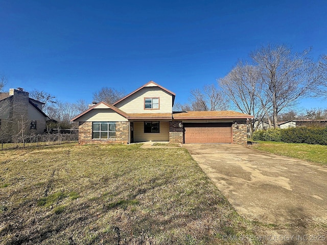 view of front of house with brick siding, an attached garage, fence, a front yard, and driveway