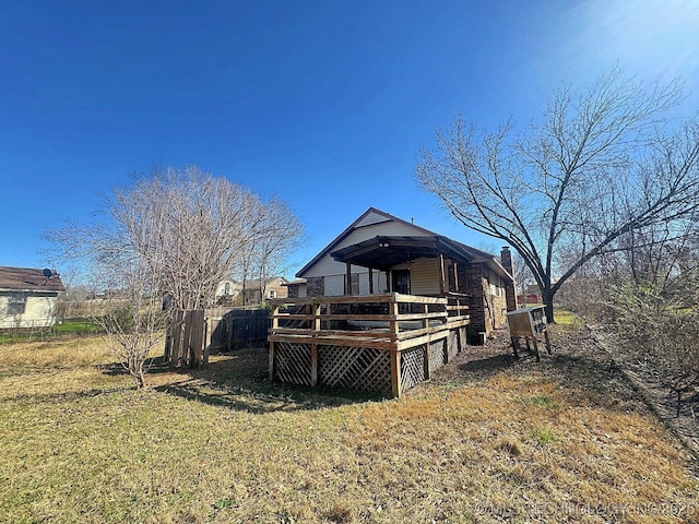 back of house with a wooden deck