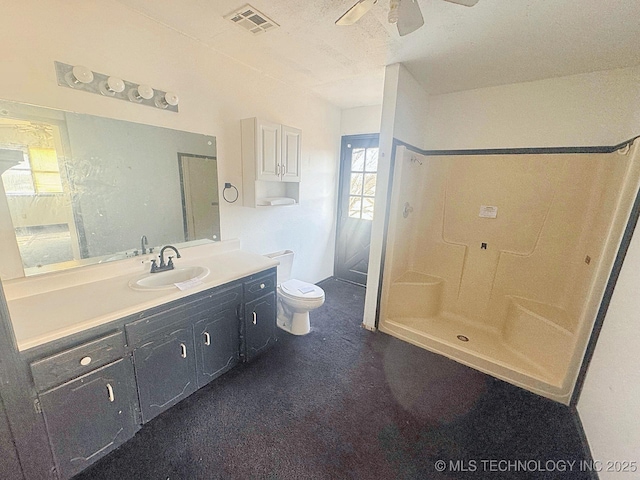 full bath featuring vanity, a ceiling fan, visible vents, a shower stall, and toilet