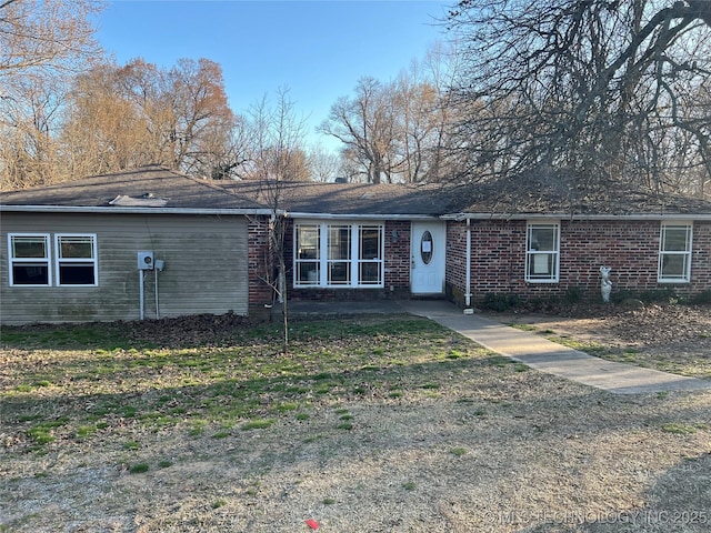 single story home with brick siding