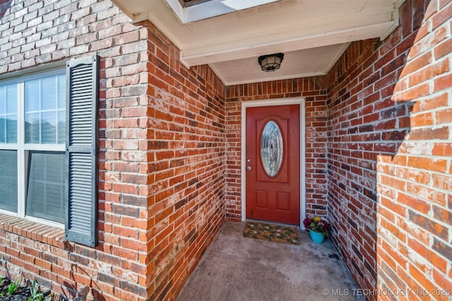 entrance to property with brick siding