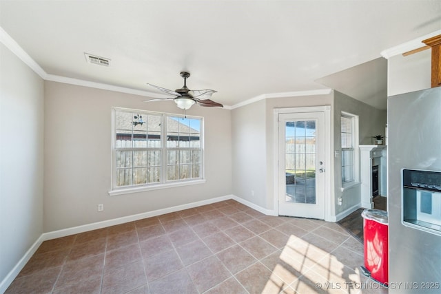 interior space featuring visible vents, a fireplace, crown molding, and baseboards