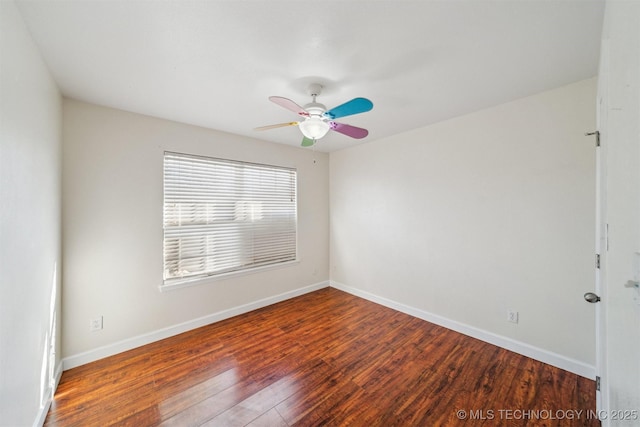 unfurnished room featuring ceiling fan, baseboards, and wood finished floors