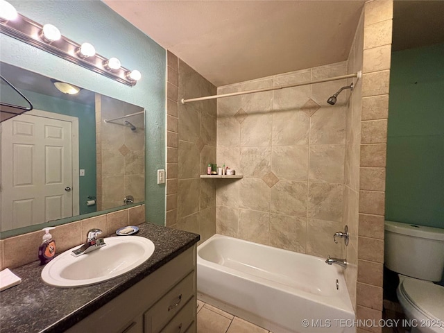 full bath featuring tile patterned flooring, toilet, vanity, and  shower combination