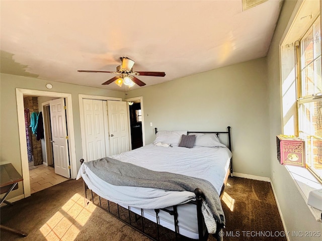 bedroom with visible vents, a closet, carpet, baseboards, and ceiling fan