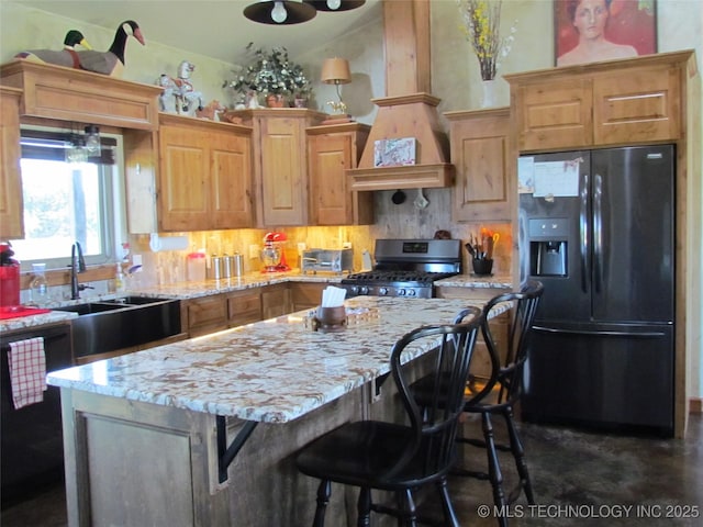 kitchen with black appliances, custom range hood, light stone counters, a kitchen island, and backsplash