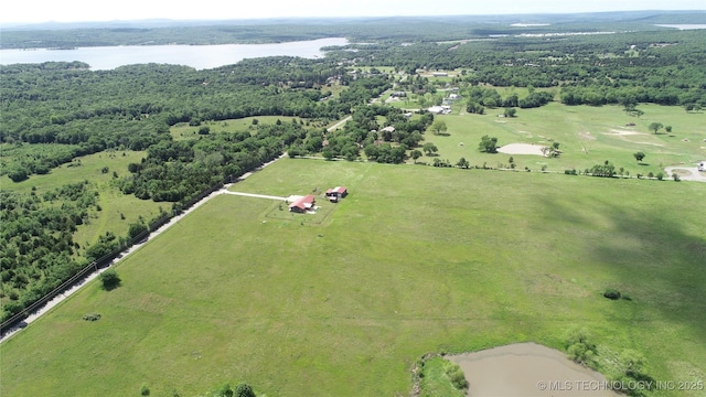 aerial view featuring a view of trees and a water view