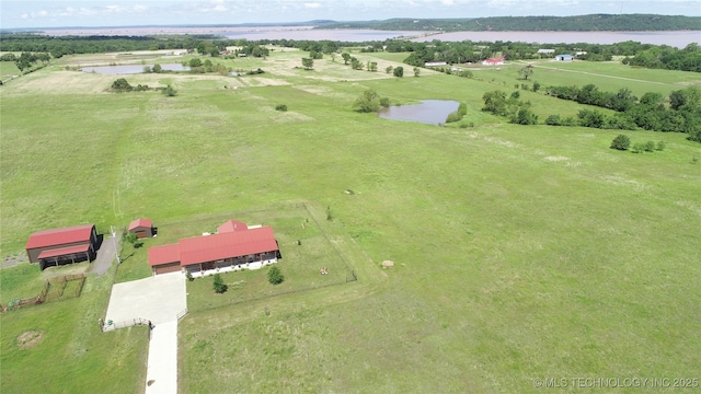 birds eye view of property with a rural view and a water view