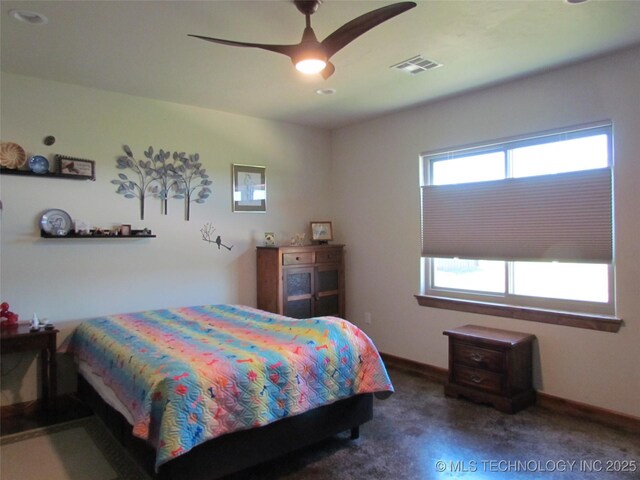 carpeted bedroom featuring visible vents, a ceiling fan, and baseboards