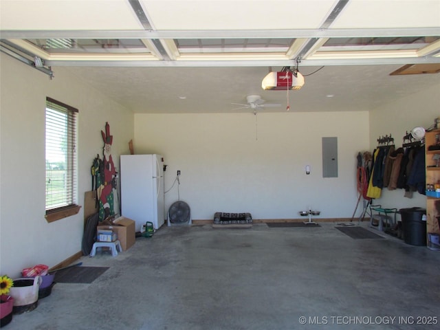 garage with electric panel, a garage door opener, and freestanding refrigerator