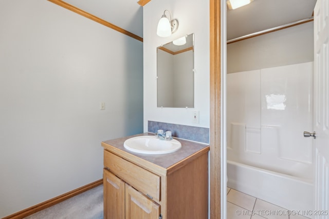 full bath featuring tile patterned flooring, baseboards, ornamental molding, bathing tub / shower combination, and vanity