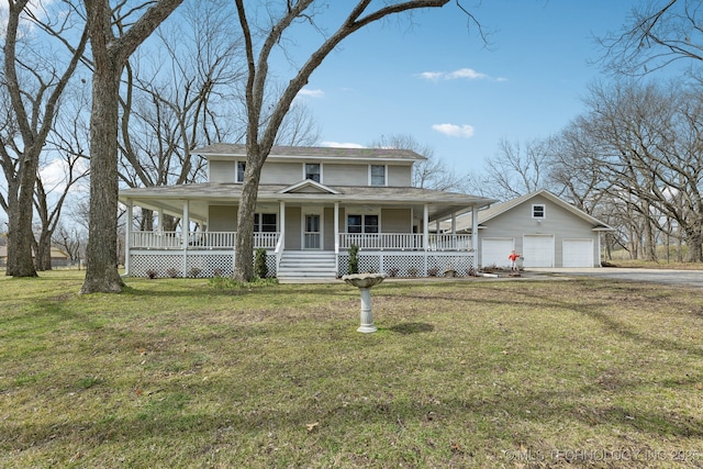 country-style home featuring a porch, a garage, an outbuilding, and a front yard