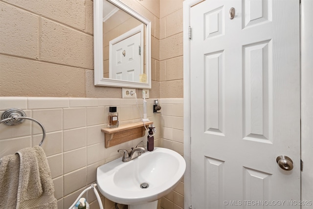 bathroom featuring a sink and wainscoting