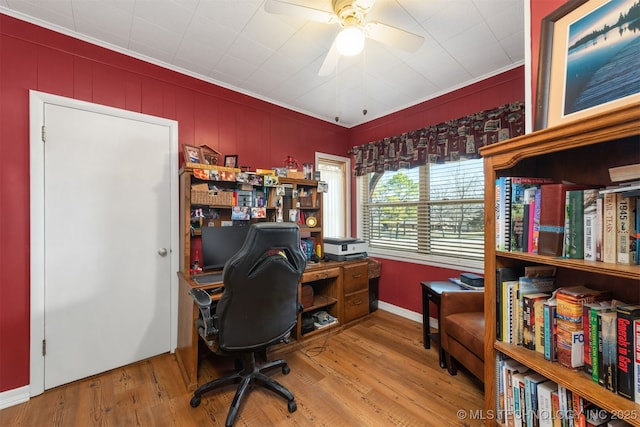 office area with wood finished floors, a ceiling fan, and ornamental molding