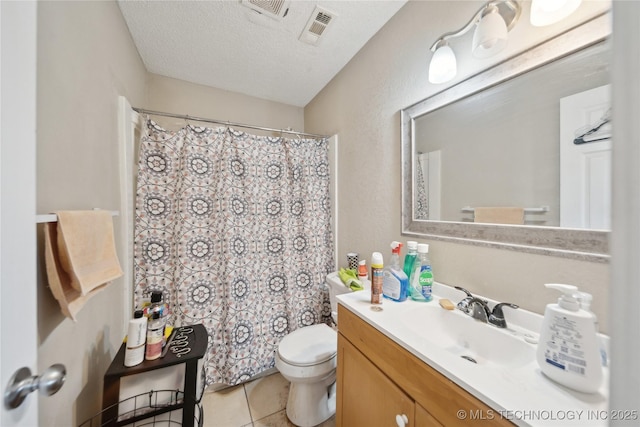 full bath featuring tile patterned floors, visible vents, toilet, a textured ceiling, and vanity