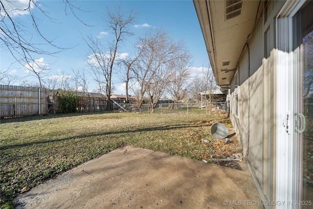 view of yard with a patio, a fenced backyard, and visible vents