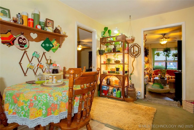 dining space featuring ceiling fan