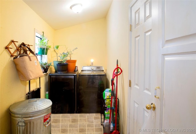 washroom featuring washer and dryer and laundry area