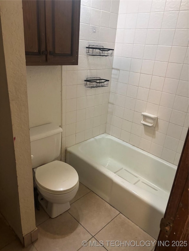 full bath with tile patterned flooring and toilet