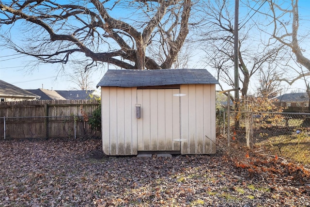 view of shed with a fenced backyard