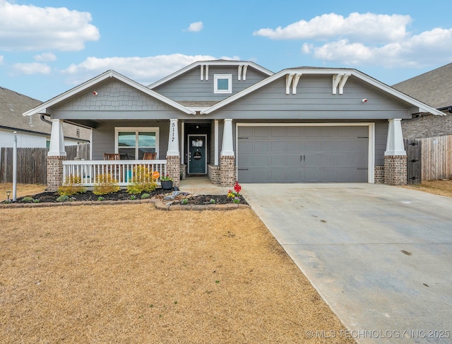 craftsman-style home with brick siding, a porch, concrete driveway, and fence