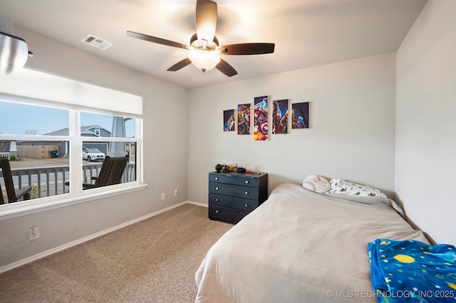 bedroom featuring a ceiling fan, baseboards, visible vents, and carpet floors