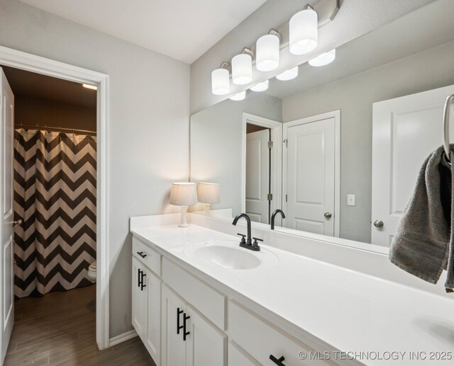 5117 S Nassau Ave, Sand Springs, OK 74063 - full bath with vanity and wood finished floors