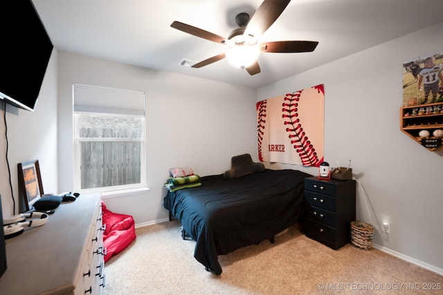 bedroom with light carpet, visible vents, baseboards, and a ceiling fan