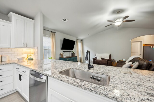 5117 S Nassau Ave, Sand Springs, OK 74063 - kitchen featuring open floor plan, dishwasher, ceiling fan, light stone counters, and arched walkways
