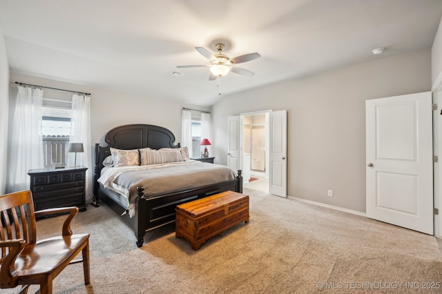 carpeted bedroom featuring visible vents, multiple windows, baseboards, and connected bathroom