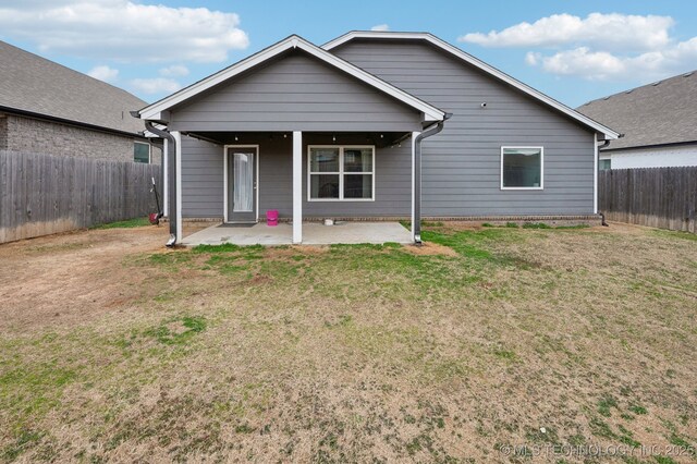 5117 S Nassau Ave, Sand Springs, OK 74063 - back of property featuring a patio area and a fenced backyard