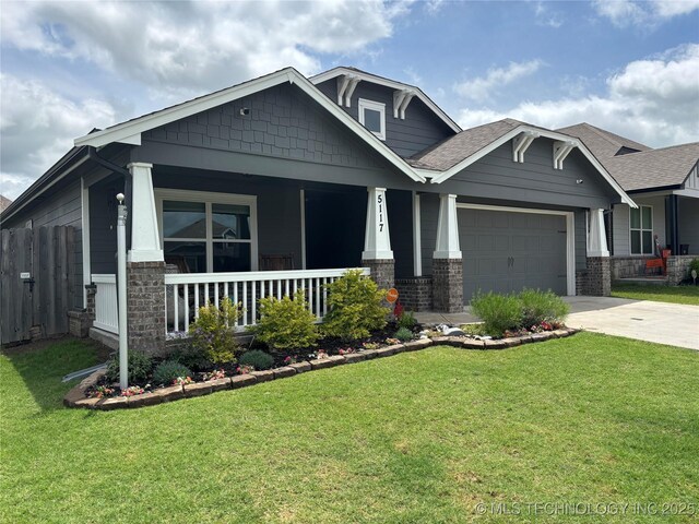 5117 S Nassau Ave, Sand Springs, OK 74063 - craftsman-style house with a porch, a garage, driveway, roof with shingles, and brick siding