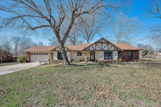 view of front of home with concrete driveway, an attached garage, a front yard, and stone siding