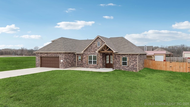 view of front facade with fence, driveway, a front lawn, a garage, and brick siding