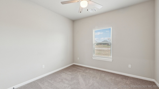 unfurnished room featuring visible vents, baseboards, carpet, and ceiling fan