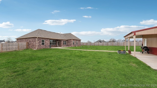 view of yard with a patio and a fenced backyard