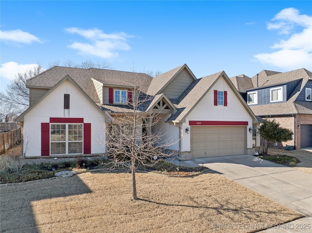 view of front of house with concrete driveway, a garage, and a shingled roof