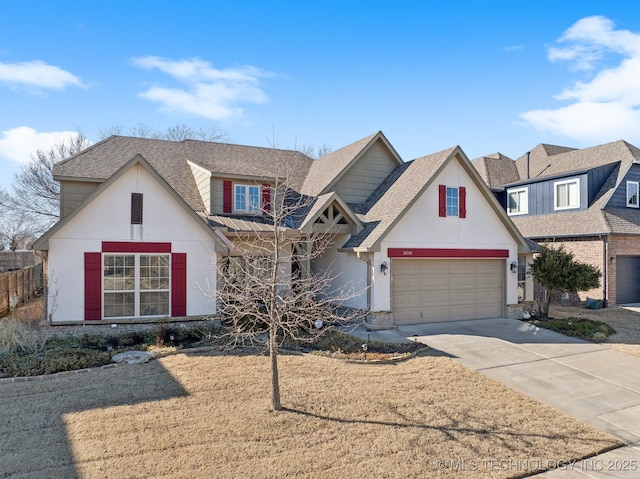 view of front of house featuring concrete driveway, a garage, and roof with shingles