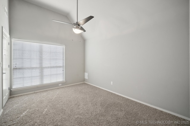 unfurnished room featuring vaulted ceiling, a ceiling fan, carpet floors, and baseboards