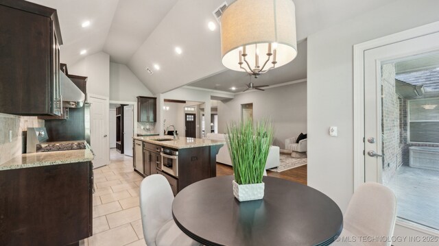 dining room featuring lofted ceiling, recessed lighting, light tile patterned floors, and ceiling fan