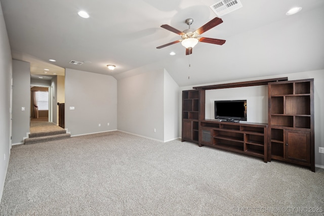 unfurnished living room with carpet, a ceiling fan, recessed lighting, vaulted ceiling, and baseboards